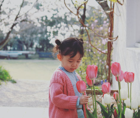 Child holding flower