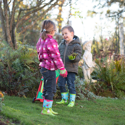 Two children wearing Blackfox Country gardening gloves and wellies