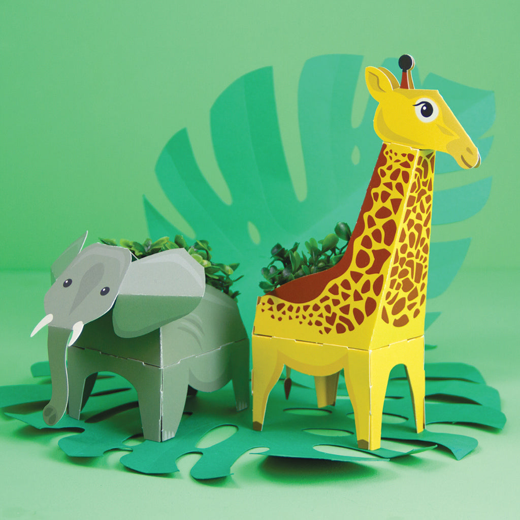 Elephant and giraffe paper planters from Clockwork Soldier Jungle Plant Pals on green background