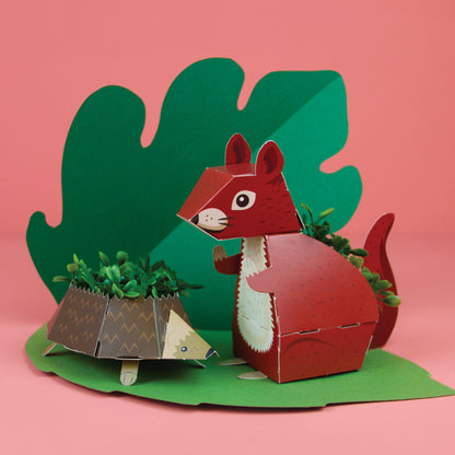 Hedgehog and squirrel paper planters from Clockwork Soldier Woodland Plant Pals with coloured background