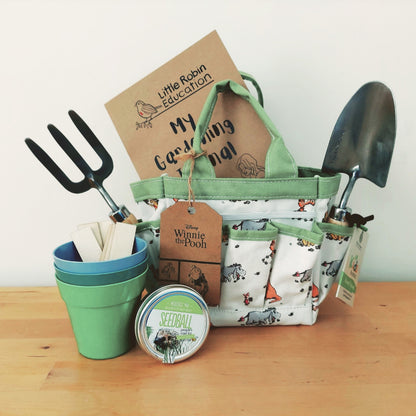 Garden set for kids with tool bag, trowel, fork, eco-pots, seedball tin, gardening journal and plant markers.