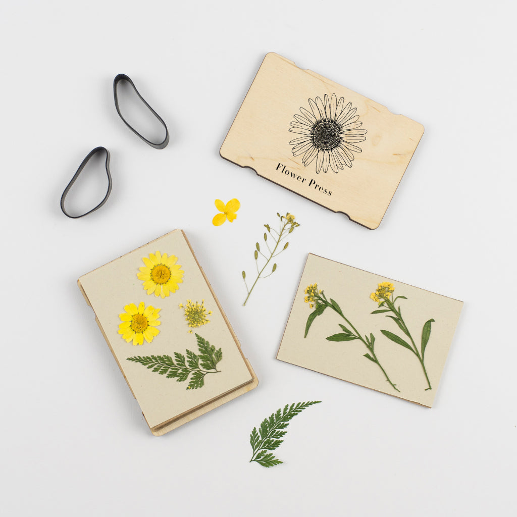 Pocket flower press for kids with sunflower design and pressed flowers