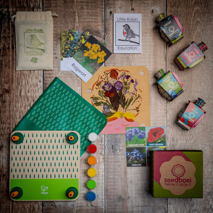 Layout of Wildflower Explorer gift set content including flower press, wildflowers flashcards and wildflower wonder seedbom box