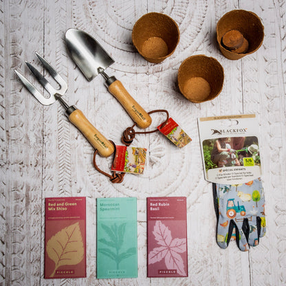 Content of gardening kit for children, Burgon & Ball tools, seeds, gloves and pots